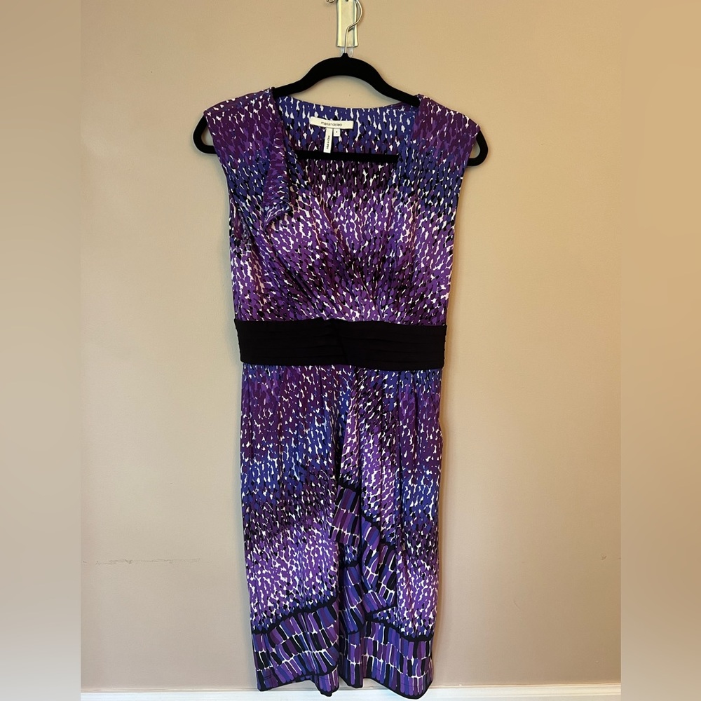 Purple and black max and Cleo dress that hit just above the knee.